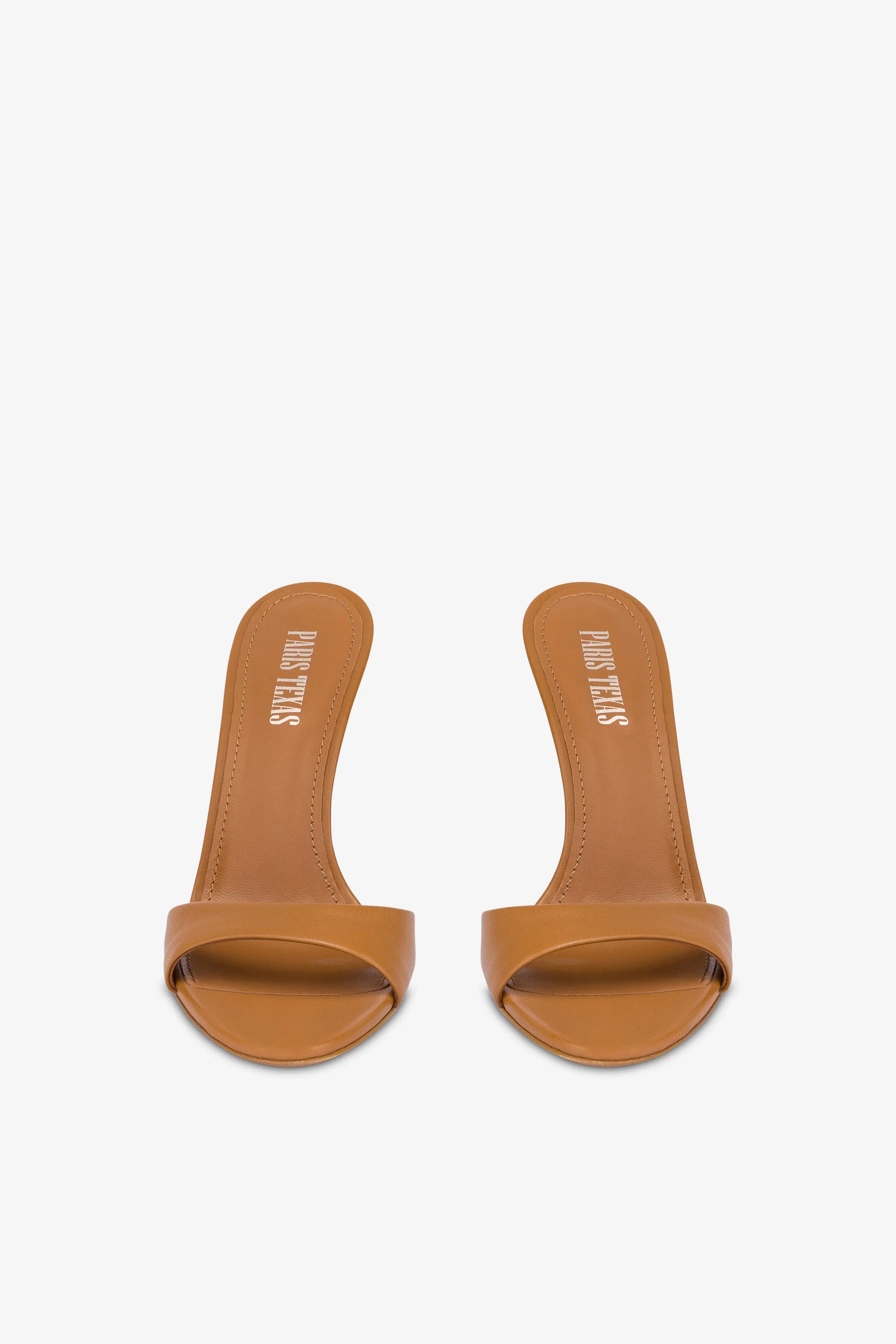 Mules in beige leather